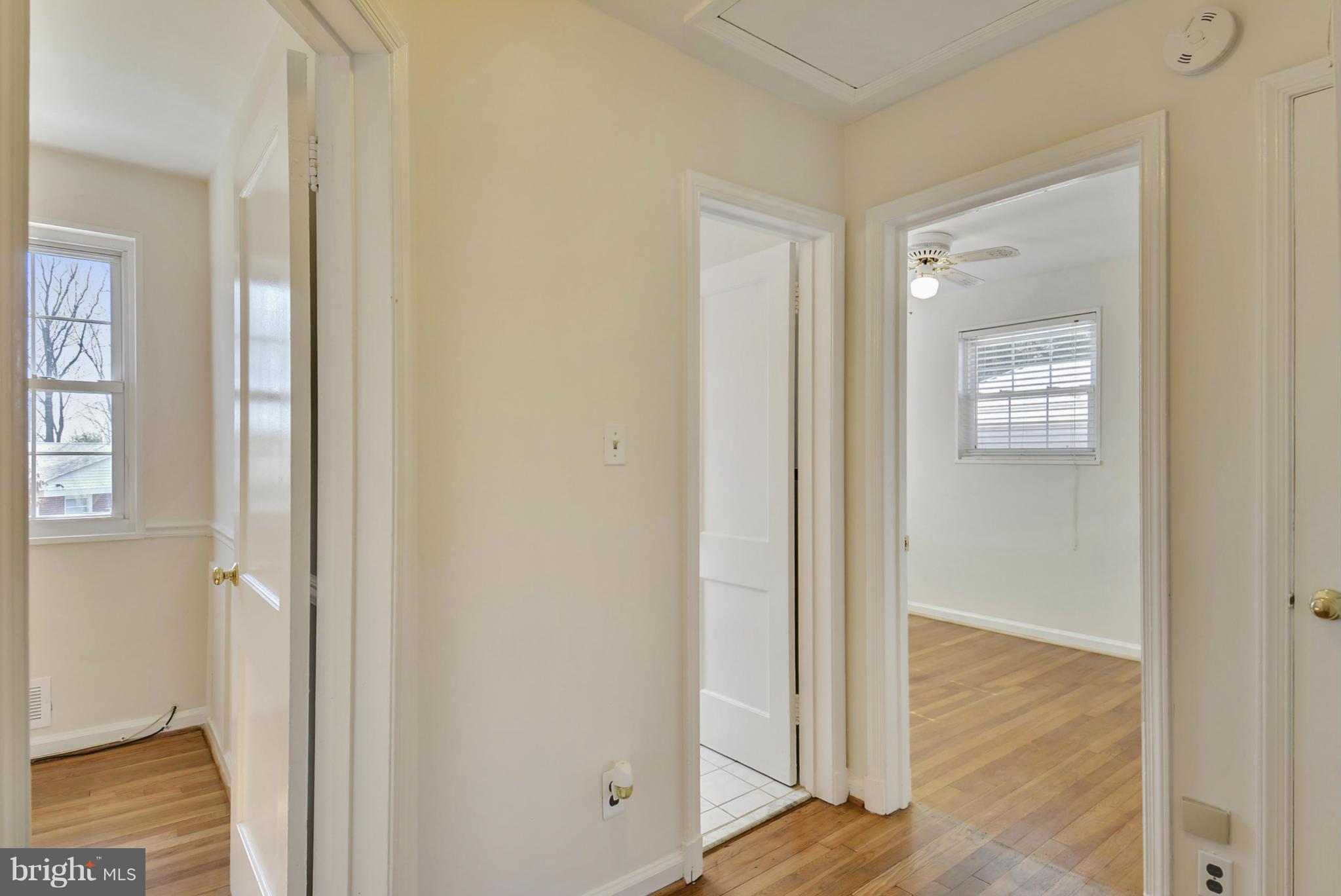 11512 Lund Place Silver Spring, MD 20902 - Photo 14 of 29 a view of room with window and wooden floor