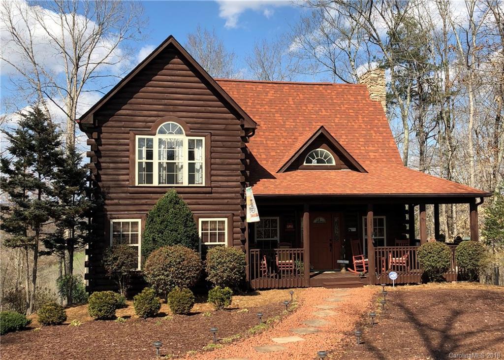 321 River Ridge Parkway, Unit 29 Rutherfordton, NC 28139 - Photo 1 of 33 a front view of a house with yard outdoor seating and garage