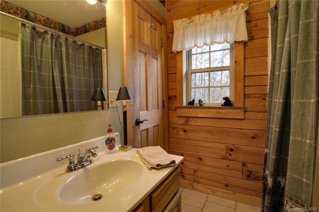 321 River Ridge Parkway, Unit 29 Rutherfordton, NC 28139 - Photo 22 of 33 a bathroom with a sink and a mirror