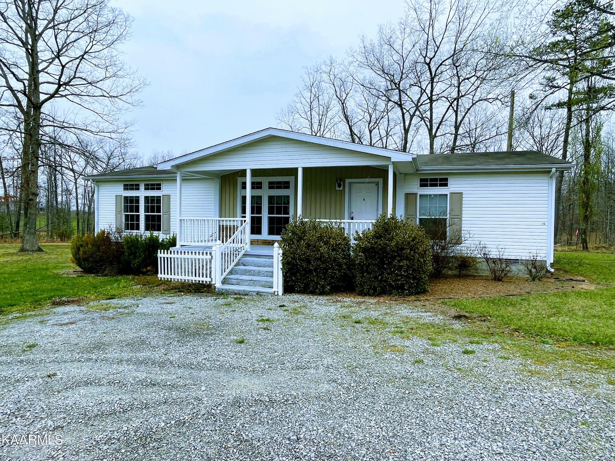 114 George Young Road Jamestown, TN 38556 - Photo 1 of 25 a front view of a house with a yard