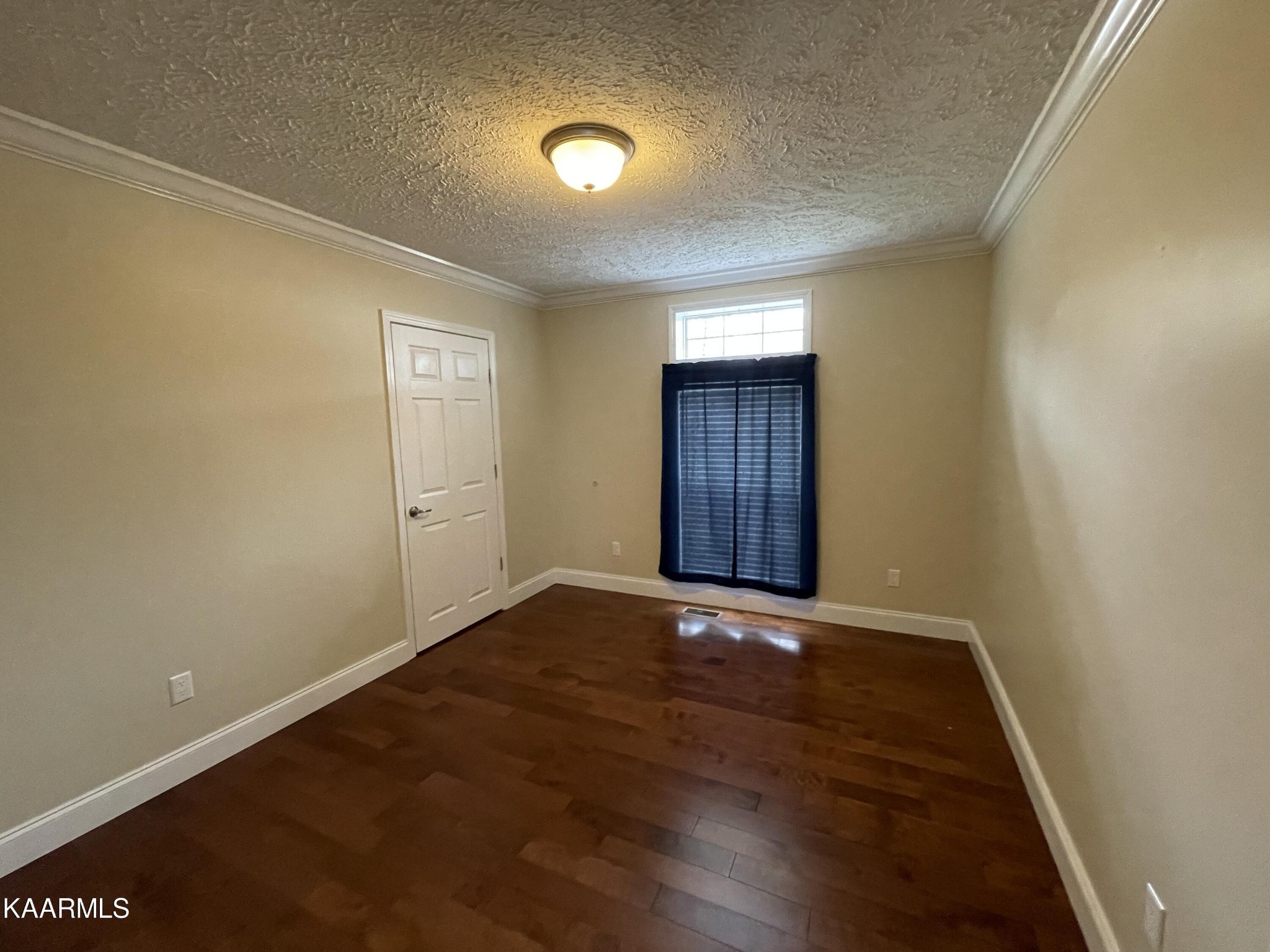 114 George Young Road Jamestown, TN 38556 - Photo 13 of 25 an empty room with wooden floor and windows