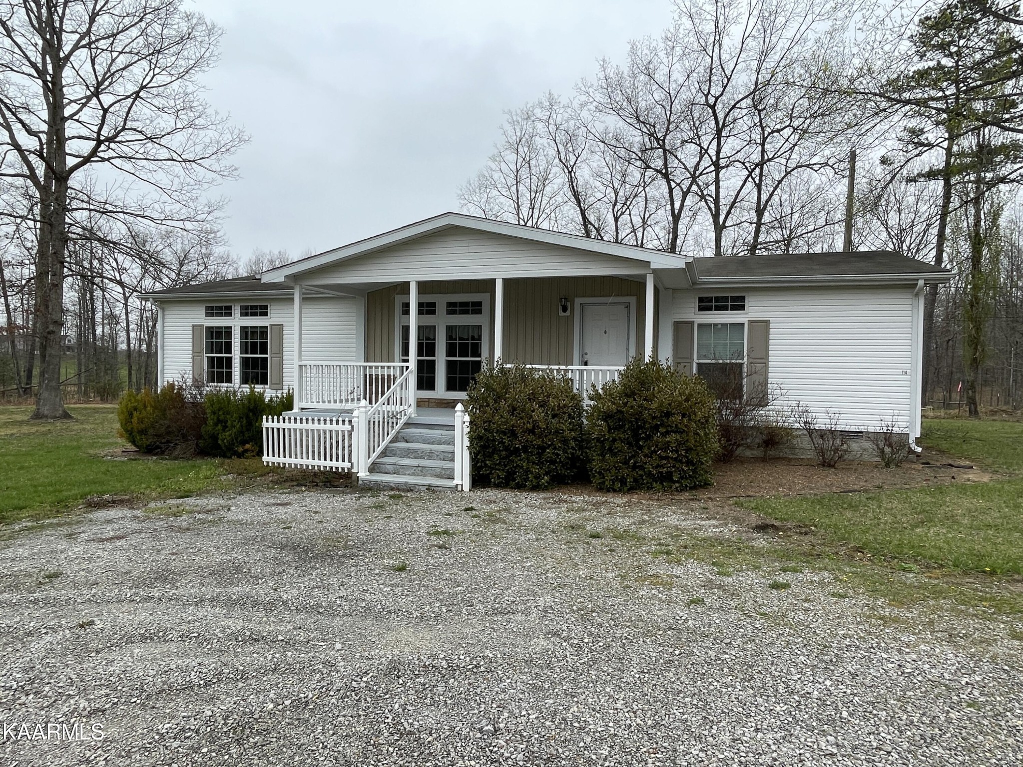114 George Young Road Jamestown, TN 38556 - Photo 23 of 25 a front view of a house with a garden