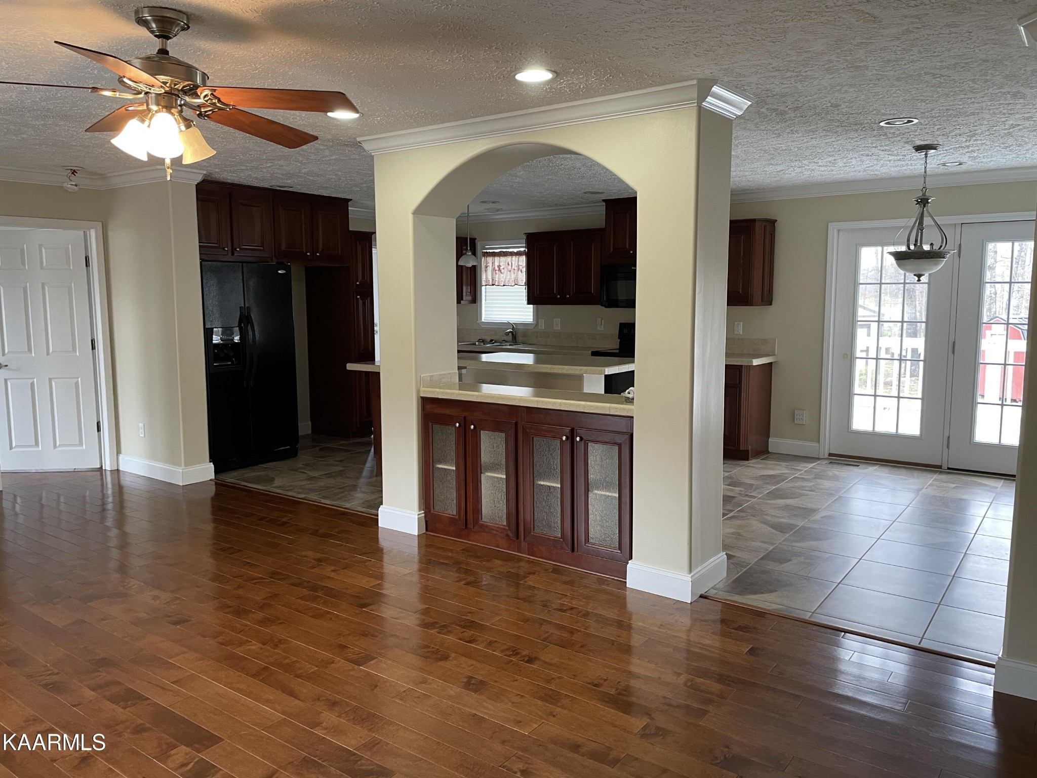 114 George Young Road Jamestown, TN 38556 - Photo 5 of 25 a view of a hallway with wooden floor and a kitchen