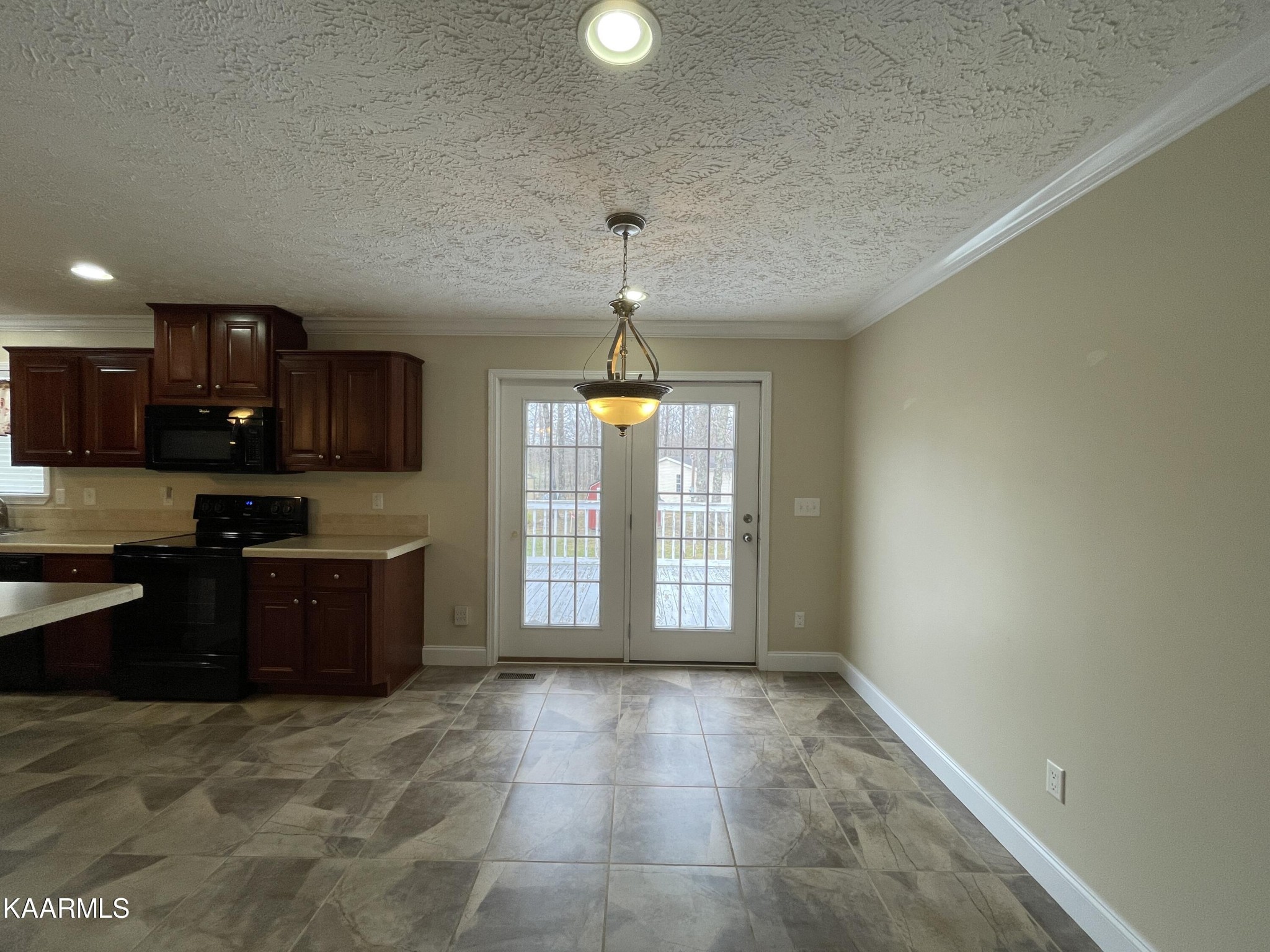 114 George Young Road Jamestown, TN 38556 - Photo 8 of 25 a large kitchen with a stove a refrigerator and a sink