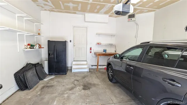 a view of kitchen and refrigerator
