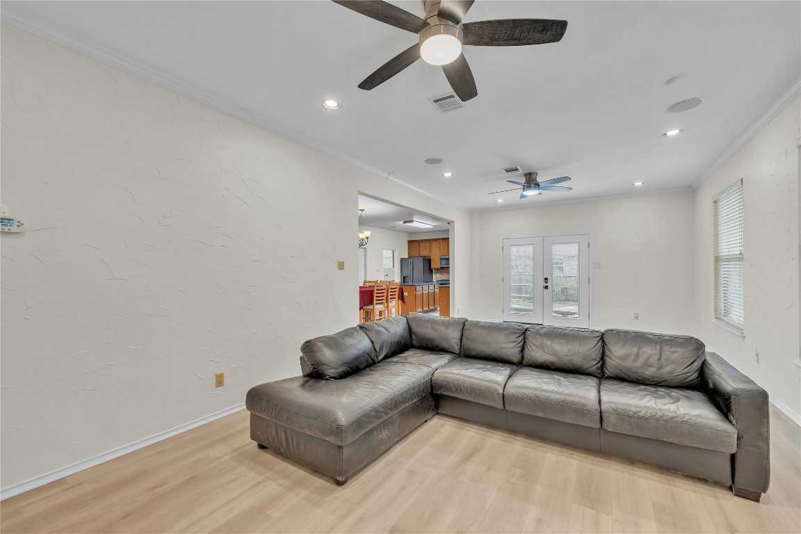 11713 Rydalwater Lane Austin, TX 78754 - Photo 12 of 29 a living room with furniture and a ceiling fan