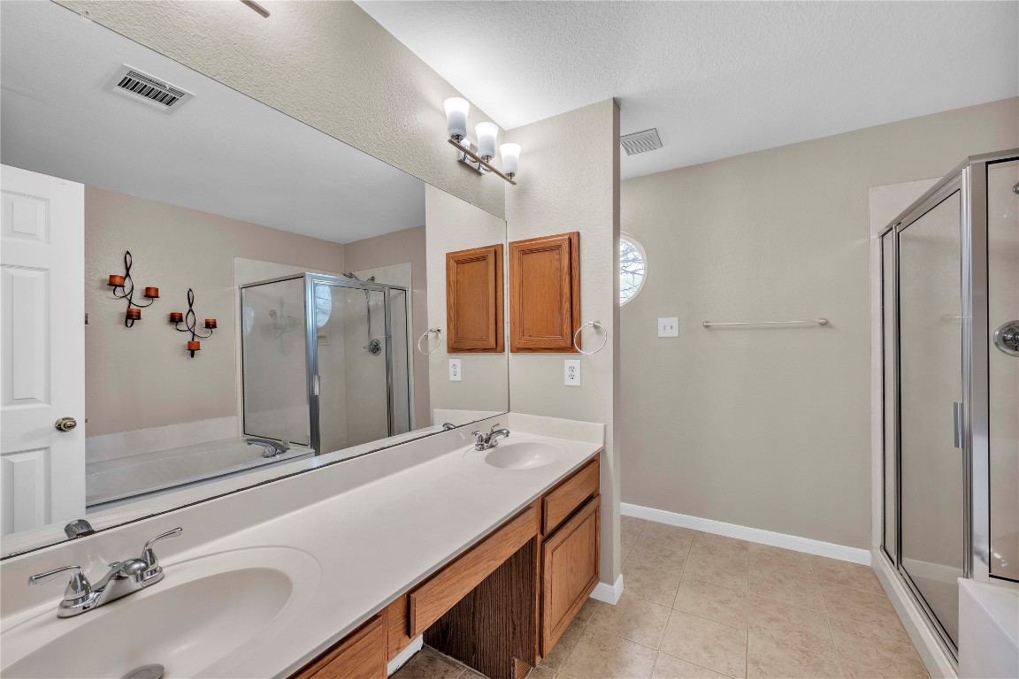 11713 Rydalwater Lane Austin, TX 78754 - Photo 15 of 29 a bathroom with a sink and a mirror
