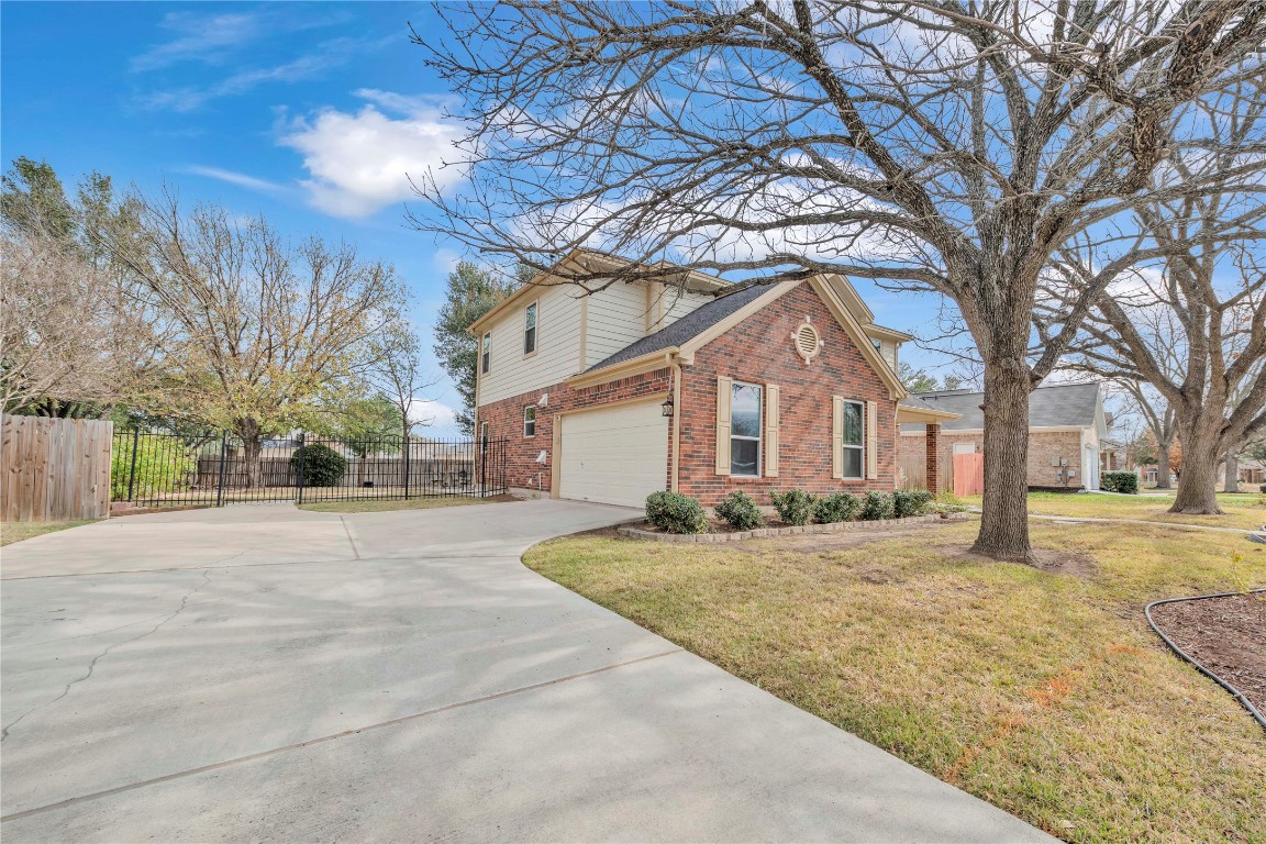 11713 Rydalwater Lane Austin, TX 78754 - Photo 3 of 29 a front view of house with yard and trees around