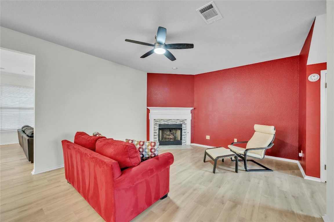 11713 Rydalwater Lane Austin, TX 78754 - Photo 6 of 29 a living room with furniture with a fireplace
