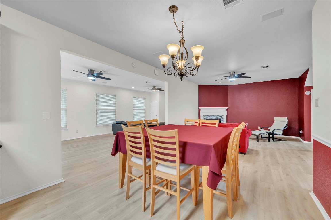 11713 Rydalwater Lane Austin, TX 78754 - Photo 7 of 29 a view of a dining room with furniture and chandelier