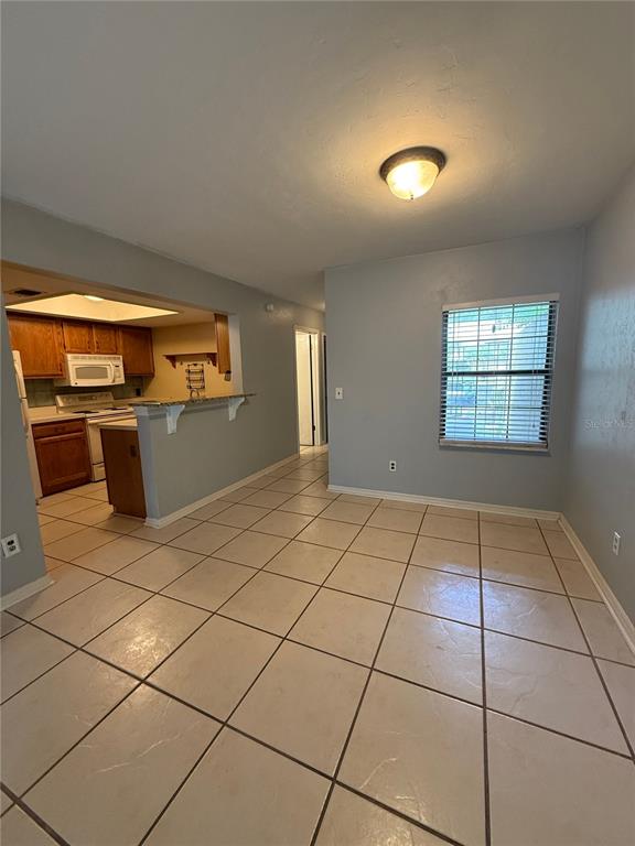 7200 Southwest 8th Avenue, Unit T128 Gainesville, FL 32607 - Photo 6 of 38 a view of kitchen with windows