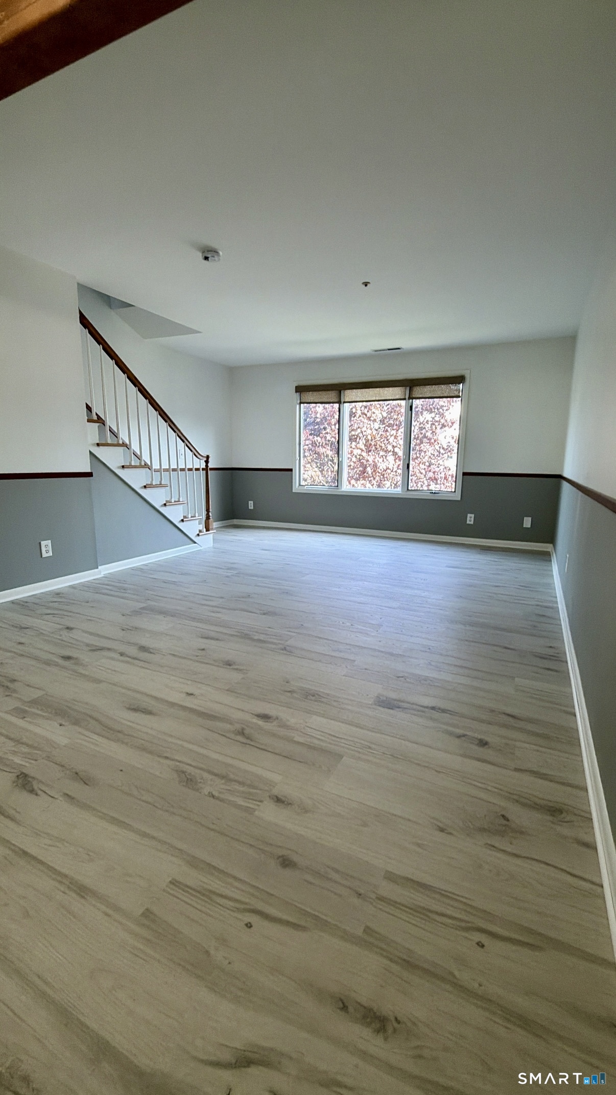 25 Cottage Street, Unit 202 Norwalk, CT 06855 - Photo 11 of 24 a view of an empty room with wooden floor and a window