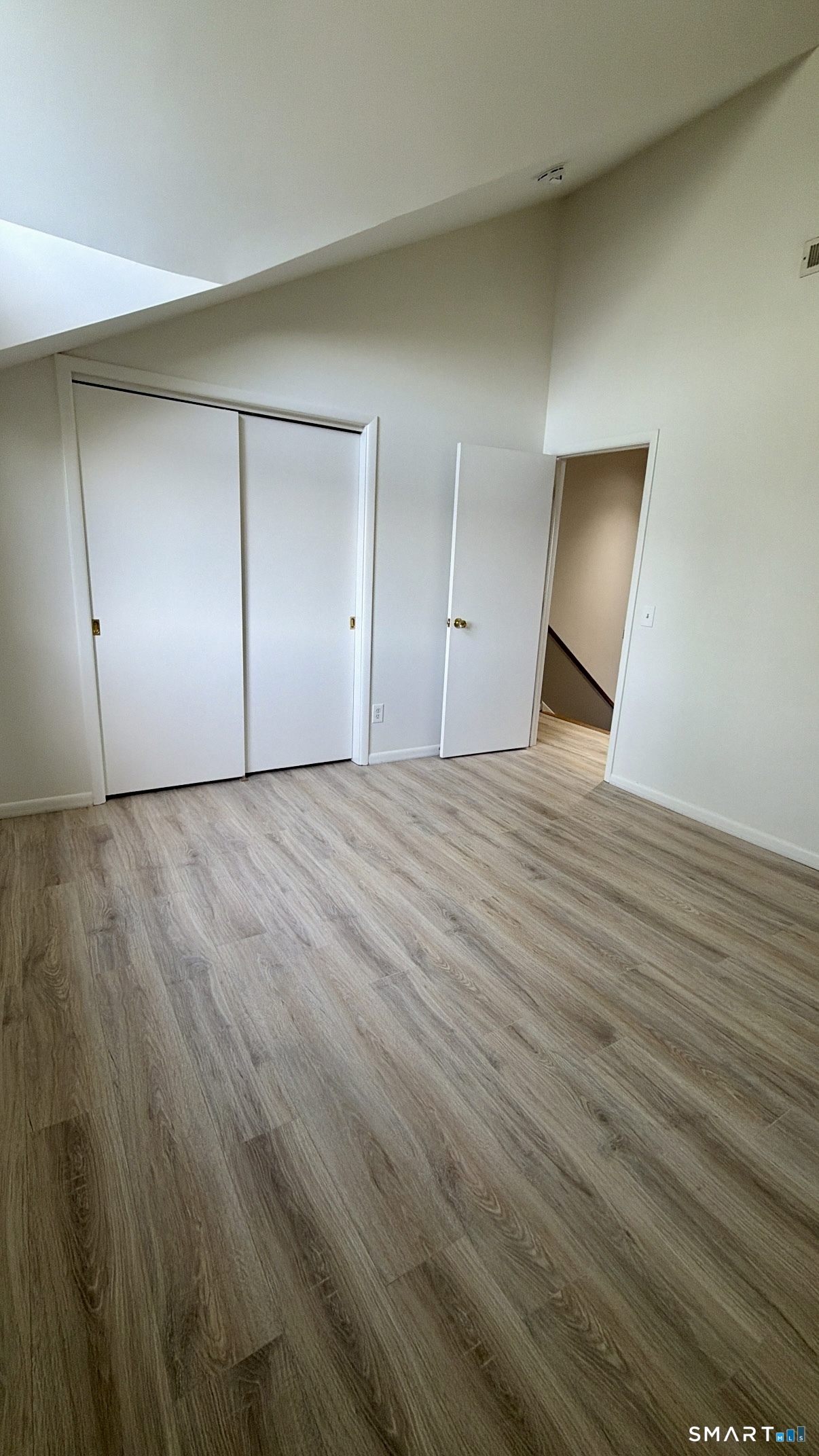 25 Cottage Street, Unit 202 Norwalk, CT 06855 - Photo 14 of 24 a view of an empty room with wooden floor
