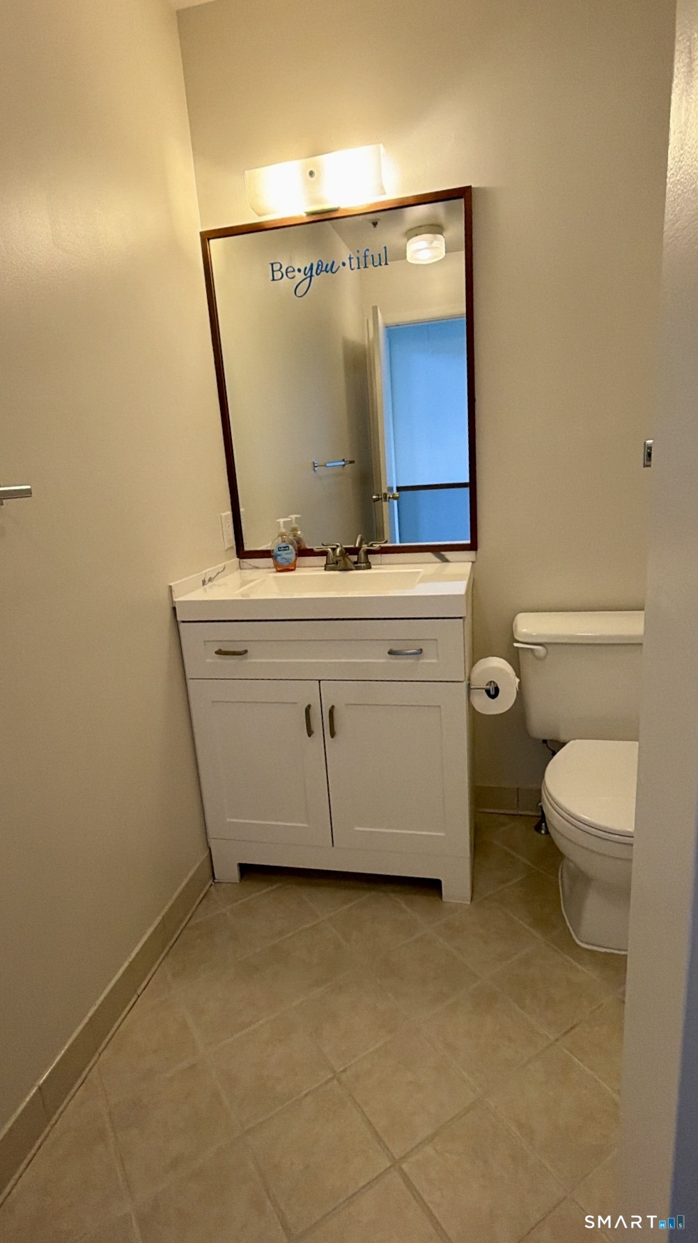 25 Cottage Street, Unit 202 Norwalk, CT 06855 - Photo 21 of 24 a bathroom with a sink a toilet and mirror