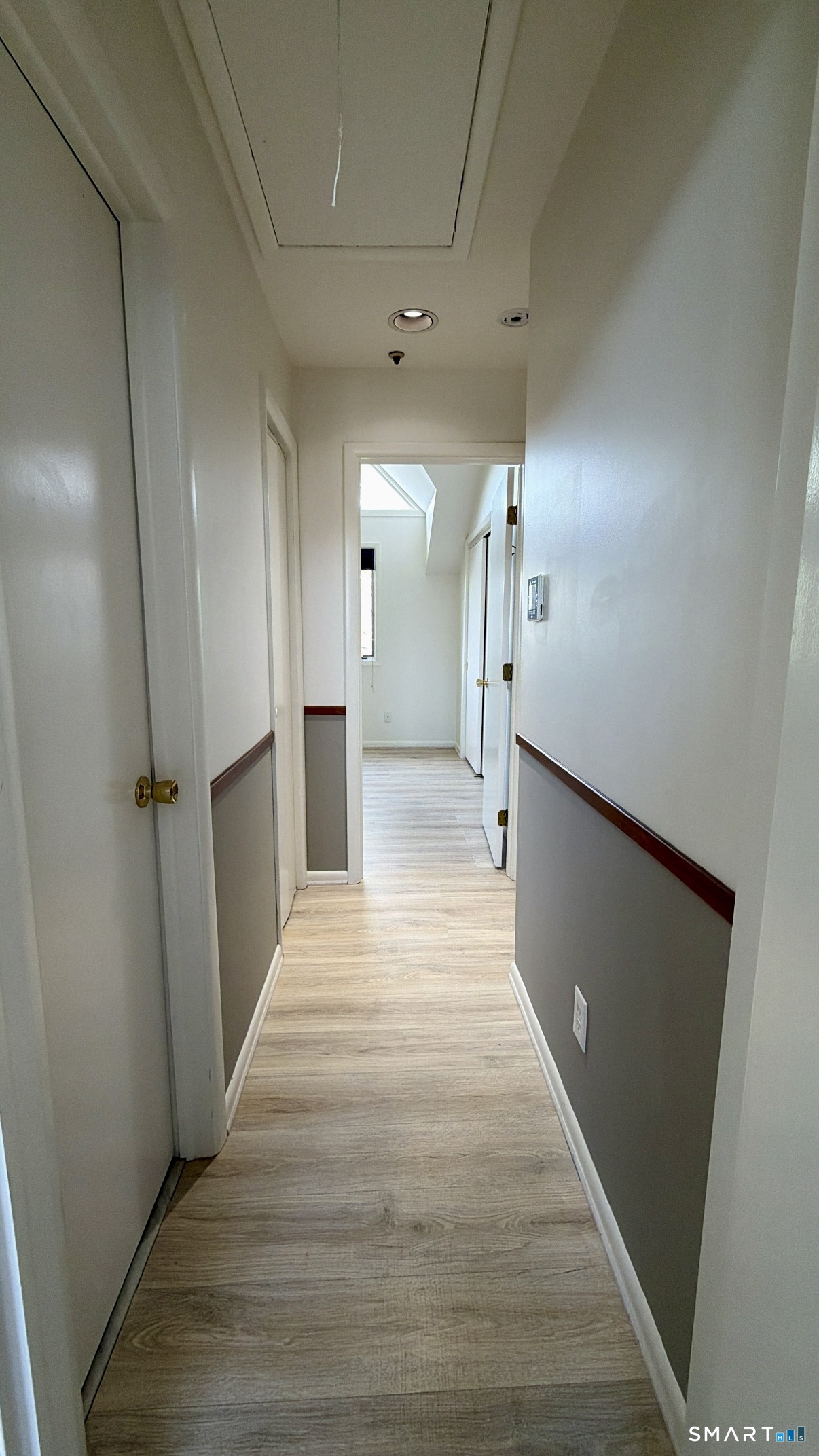25 Cottage Street, Unit 202 Norwalk, CT 06855 - Photo 23 of 24 a view of a hallway with wooden floor