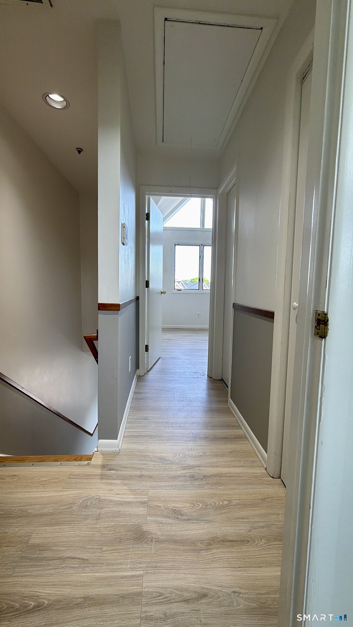 25 Cottage Street, Unit 202 Norwalk, CT 06855 - Photo 24 of 24 a view of a hallway with wooden floor and staircase