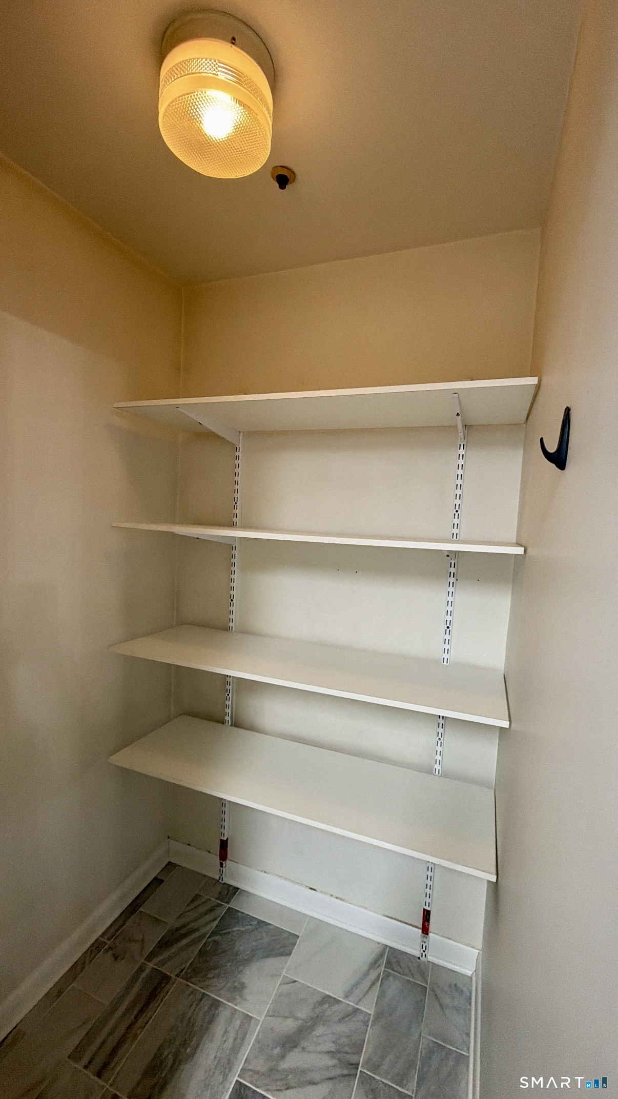 25 Cottage Street, Unit 202 Norwalk, CT 06855 - Photo 6 of 24 a view of a room with racks on the wall