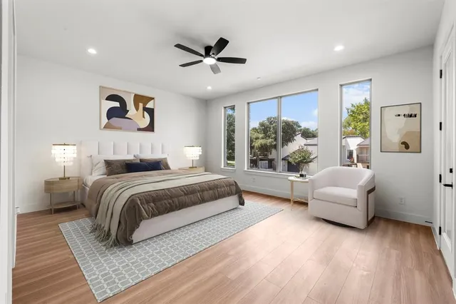 a bedroom with a large bed and a couch