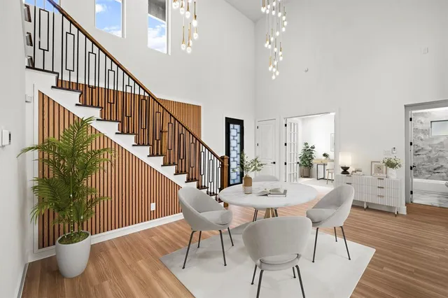 a view of a dining room with furniture window and wooden floor