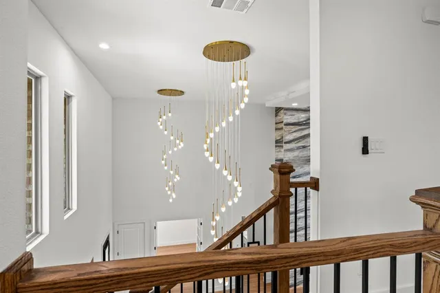 a view of entryway and hall with a front door