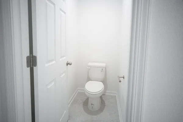 a bathroom with a toilet and a sink