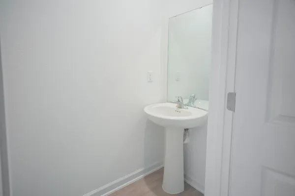 a sink view with a mirror