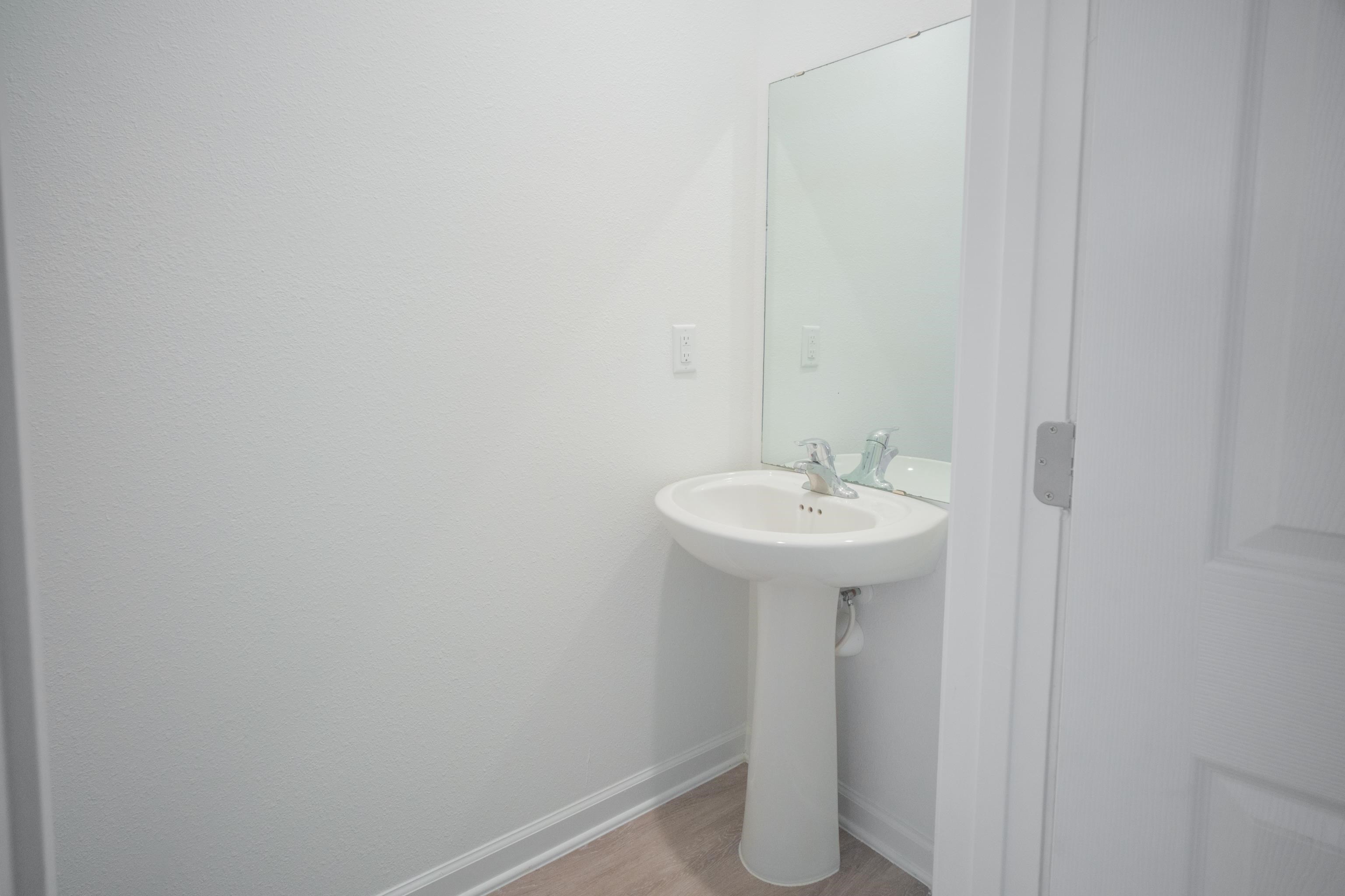 26 Ridge Lake Road St. Augustine, FL 32086 - Photo 17 of 27 a sink view with a mirror