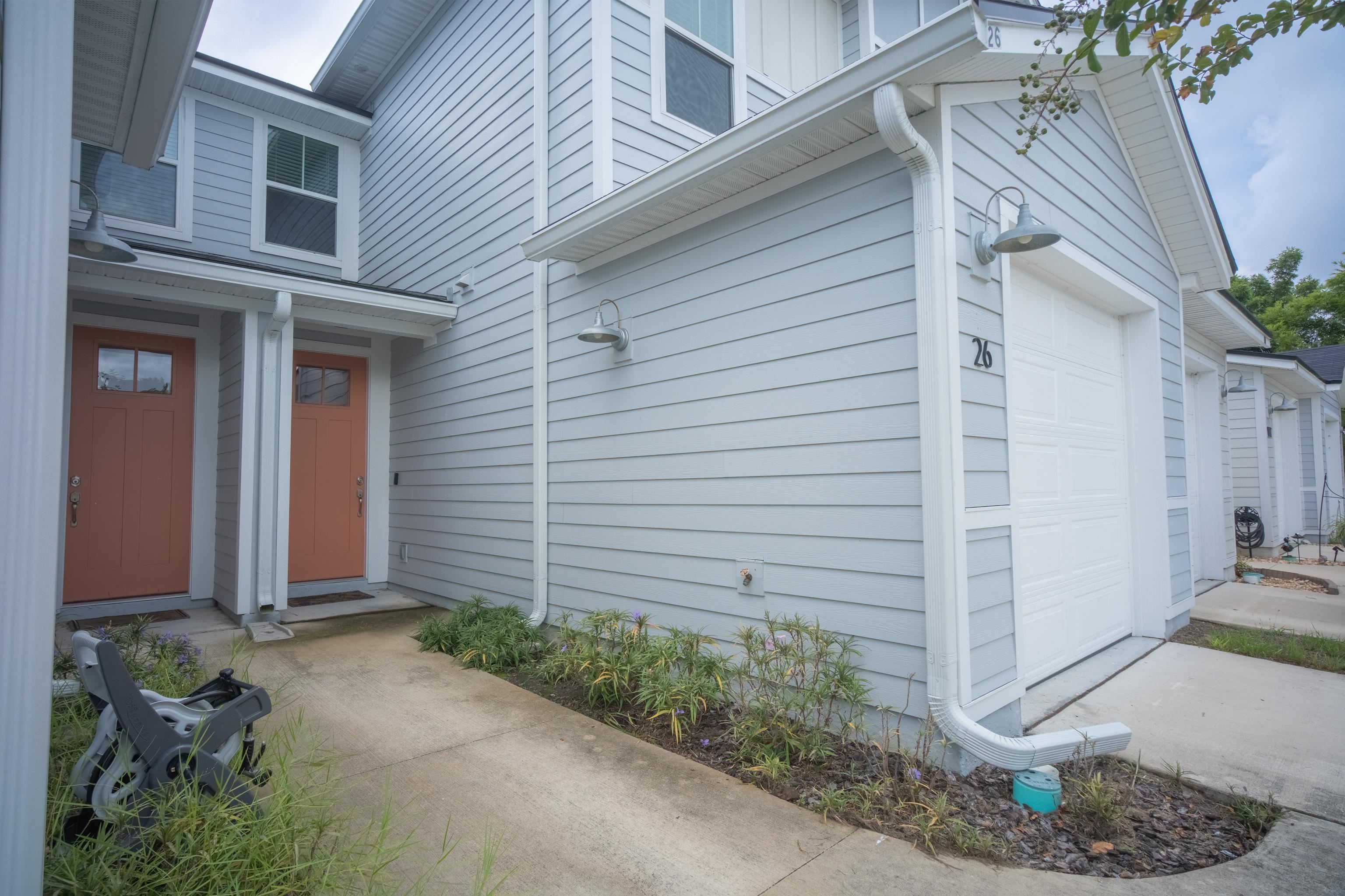 26 Ridge Lake Road St. Augustine, FL 32086 - Photo 2 of 27 a front view of a house with a garden