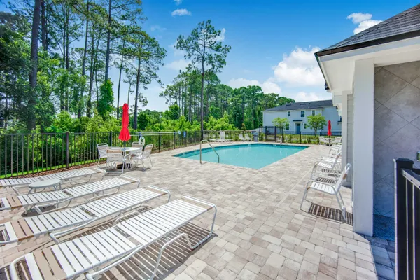 a view of a backyard with sitting area