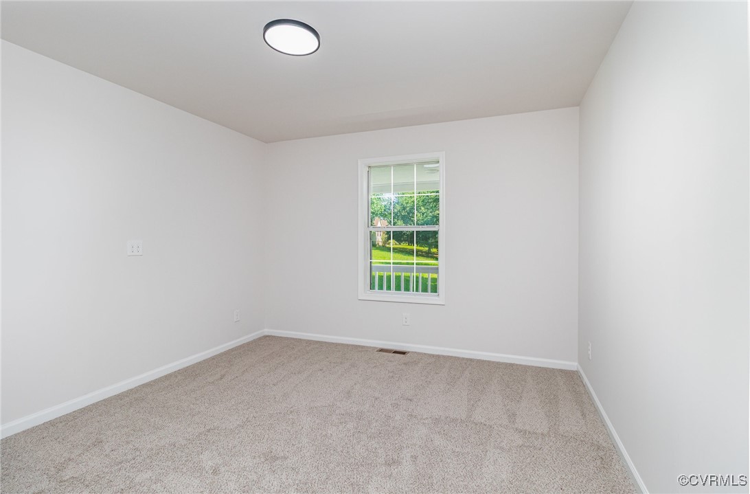 24 Hummingbird Lane Cumberland, VA 23040 - Photo 13 of 38 an empty room with a empty space and a window