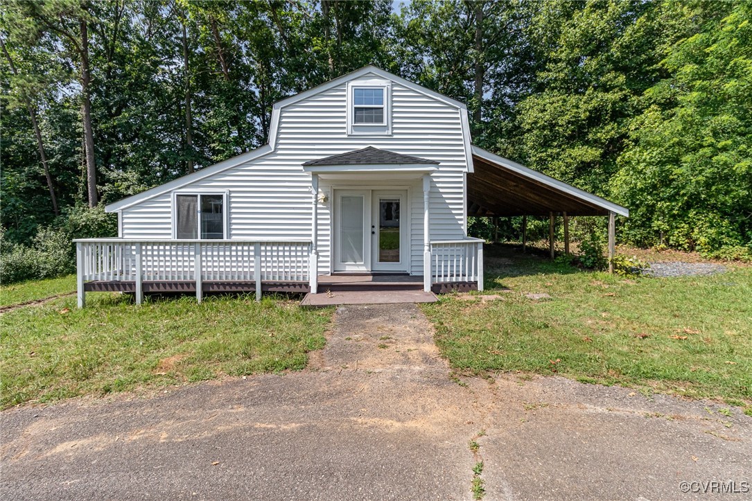 24 Hummingbird Lane Cumberland, VA 23040 - Photo 26 of 38 a front view of a house with garden