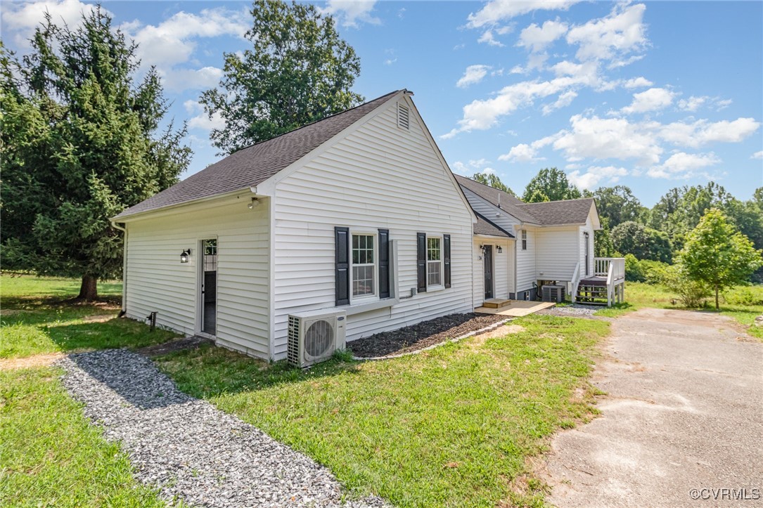 24 Hummingbird Lane Cumberland, VA 23040 - Photo 4 of 38 a view of a house with a yard and large tree