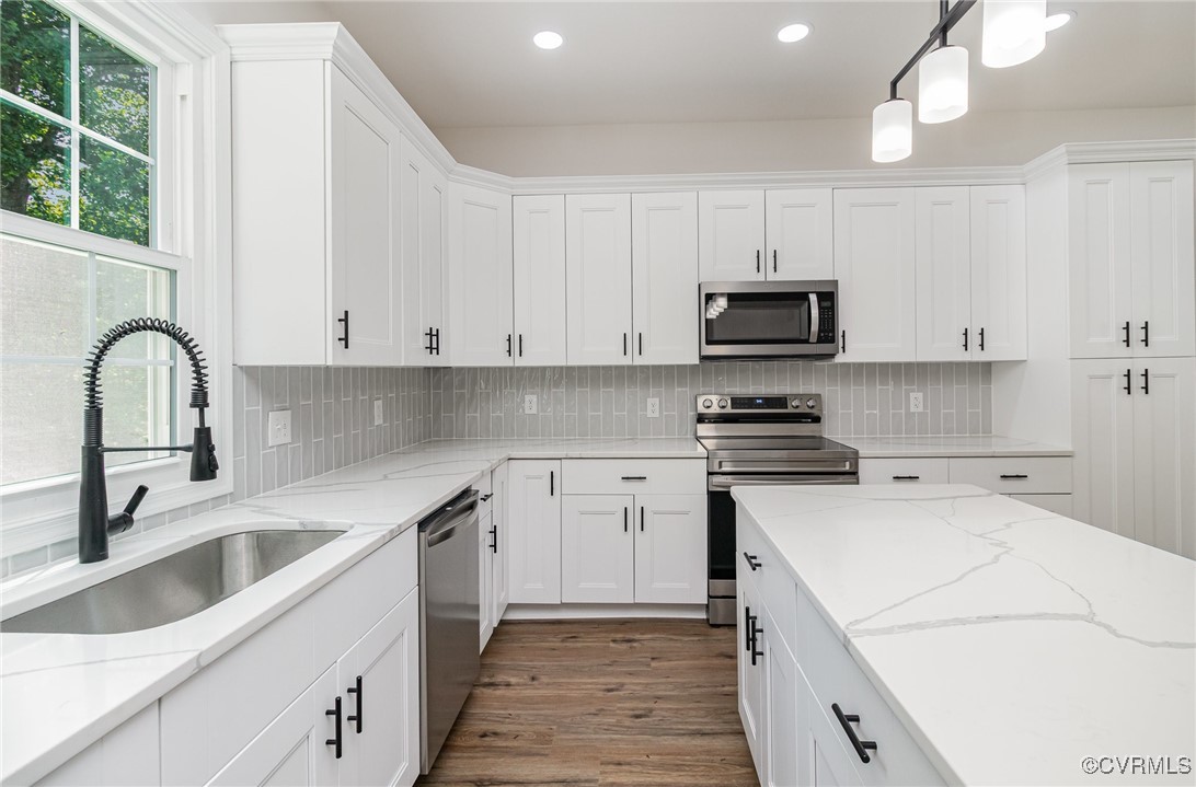 24 Hummingbird Lane Cumberland, VA 23040 - Photo 8 of 38 a kitchen with cabinets appliances a sink and a window