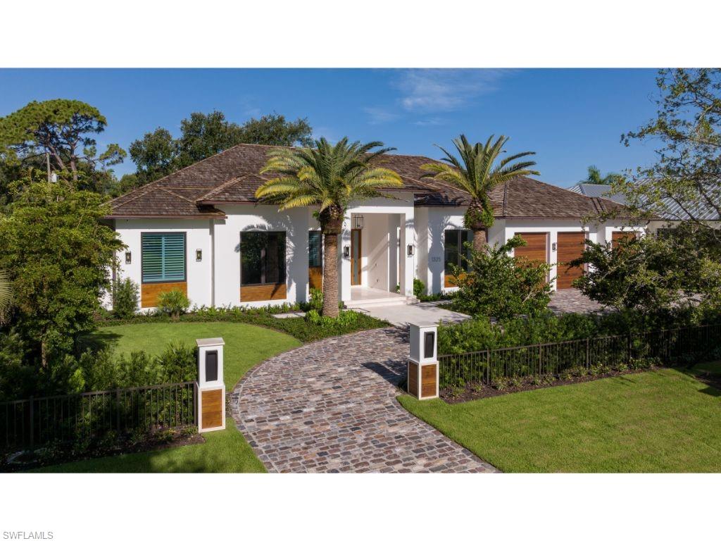 1325 Murex Drive Naples, FL 34102 - Photo 1 of 18 a black and white photo of a house