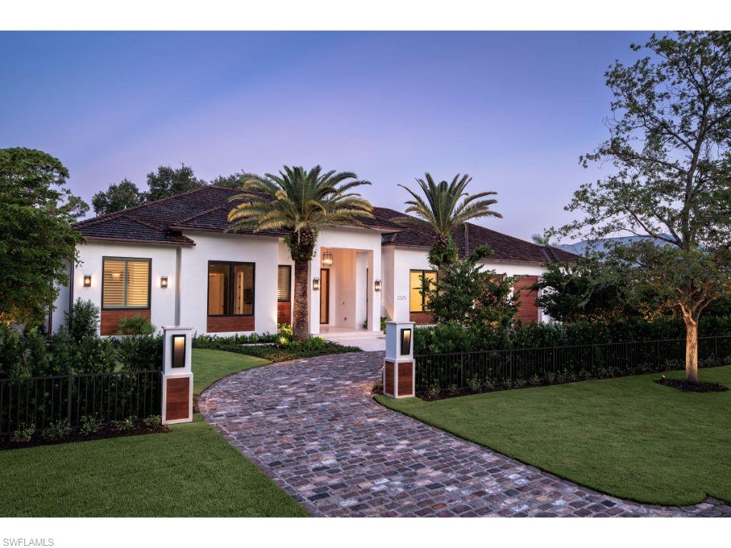 1325 Murex Drive Naples, FL 34102 - Photo 18 of 18 a palm tree sitting in front of a house with a yard