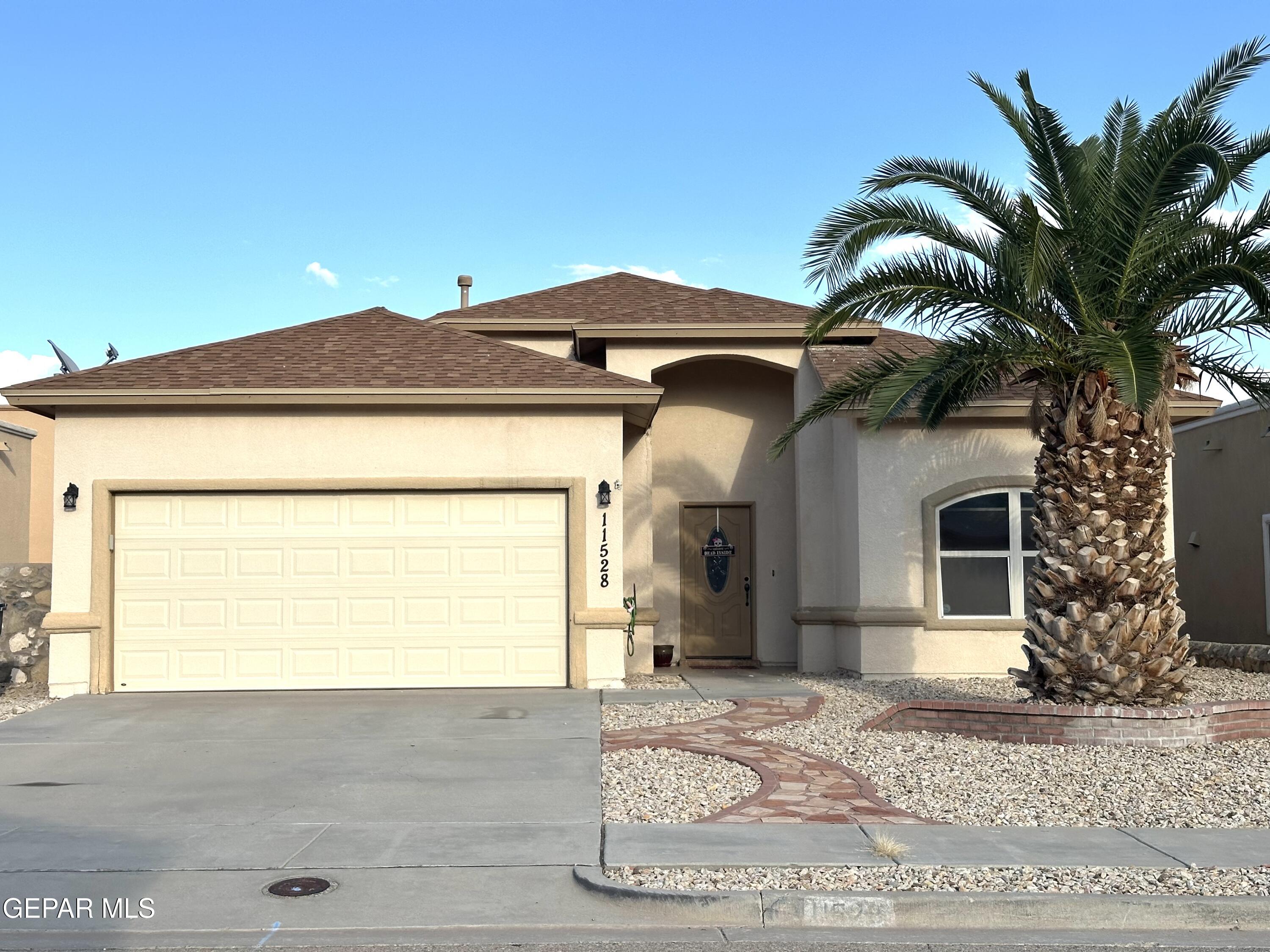 11528 Rafael Serna Lane El Paso, TX 79934 - Photo 1 of 22 a front view of a house with a yard