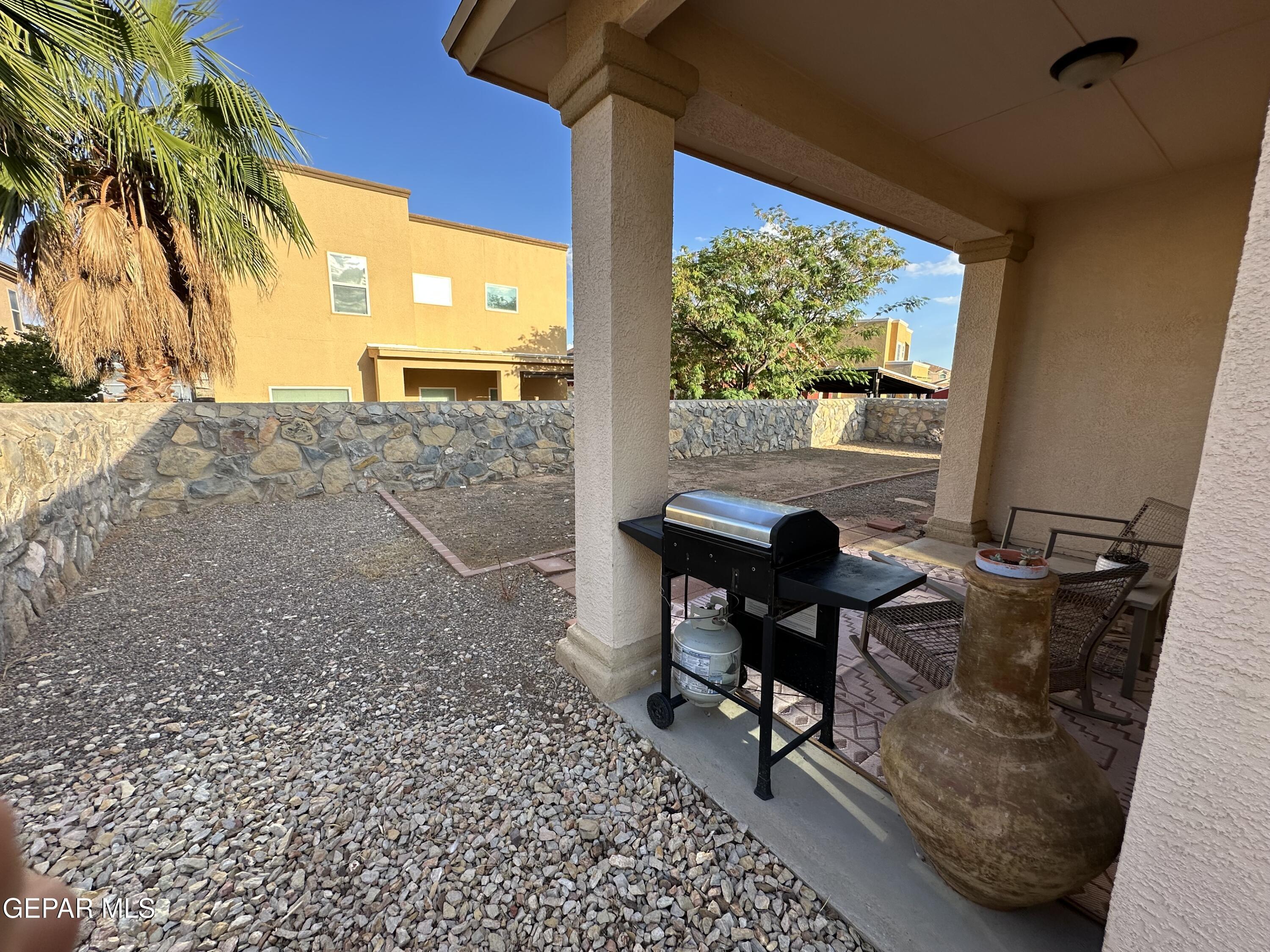11528 Rafael Serna Lane El Paso, TX 79934 - Photo 14 of 22 a view of a workspace with furniture and a window