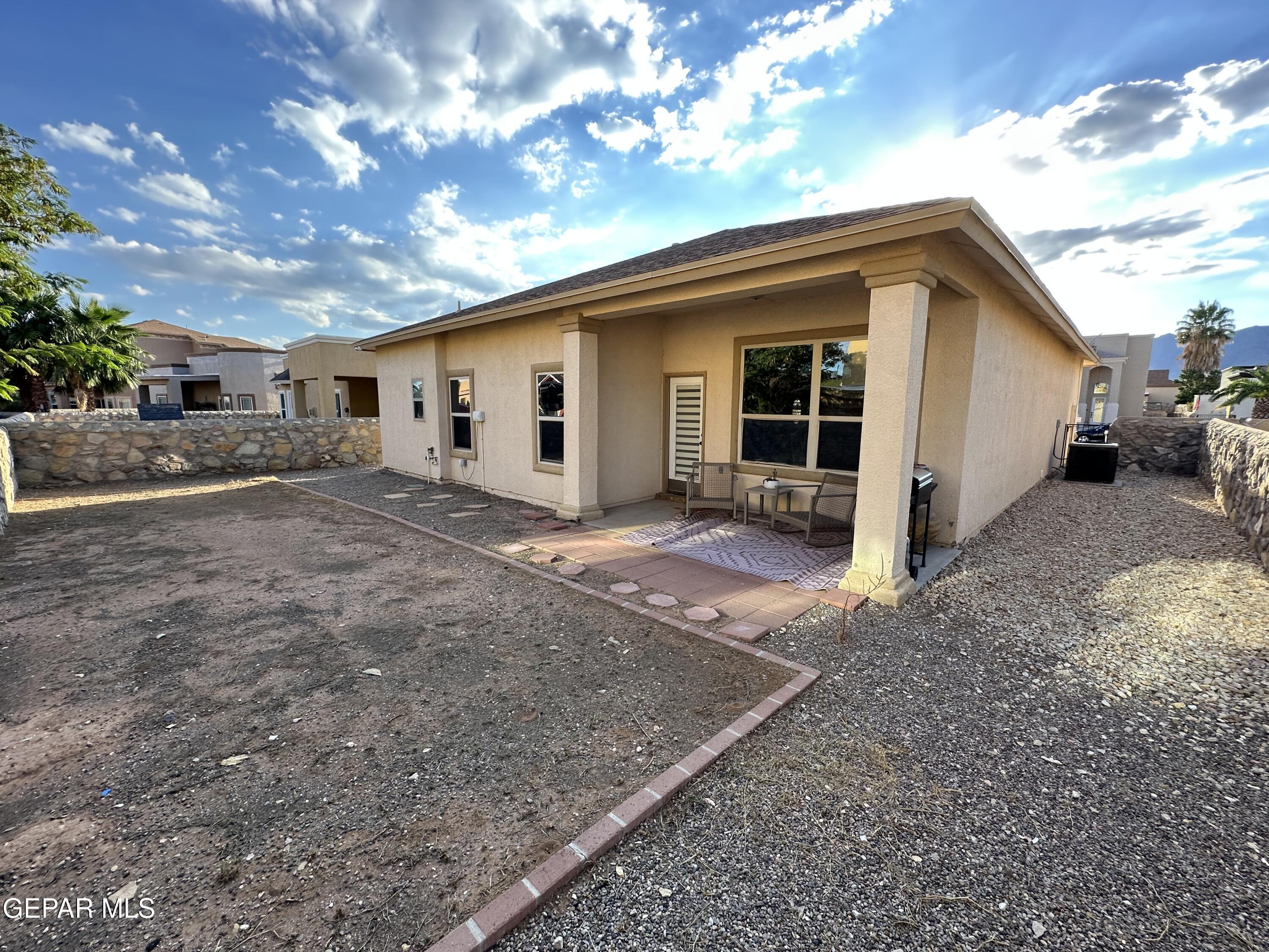 11528 Rafael Serna Lane El Paso, TX 79934 - Photo 15 of 22 a view of a house with a yard