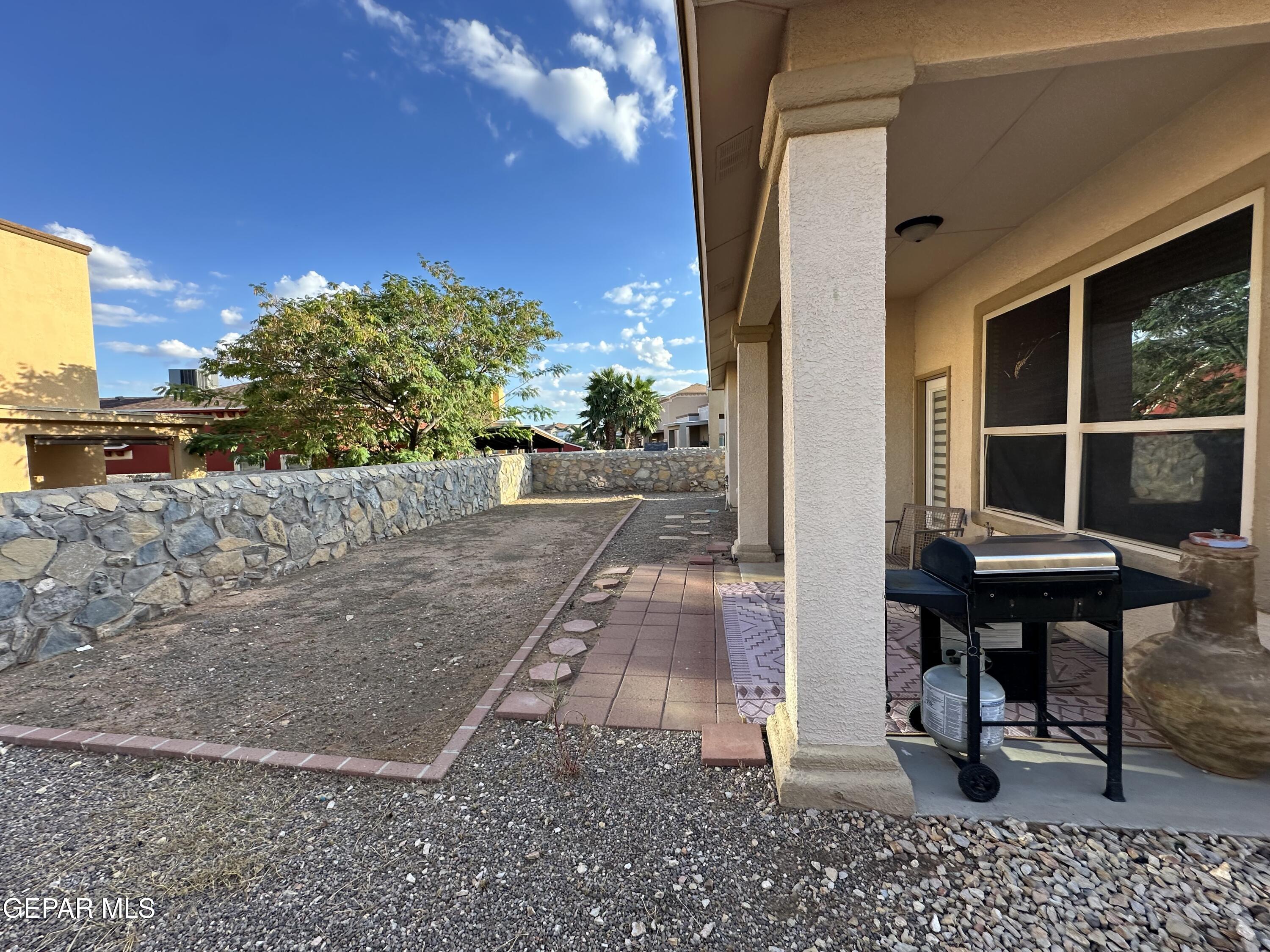 11528 Rafael Serna Lane El Paso, TX 79934 - Photo 18 of 22 a view of a bench in a patio