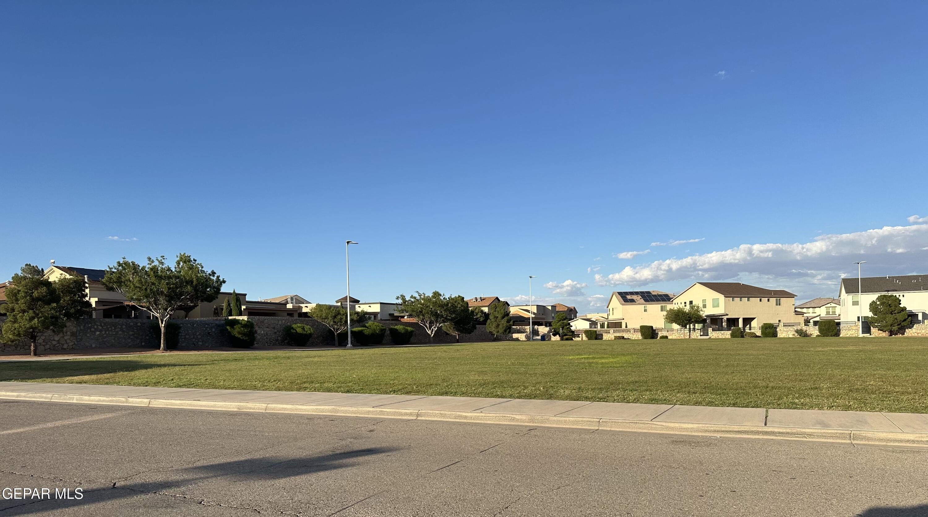 11528 Rafael Serna Lane El Paso, TX 79934 - Photo 20 of 22 a view of building with yard