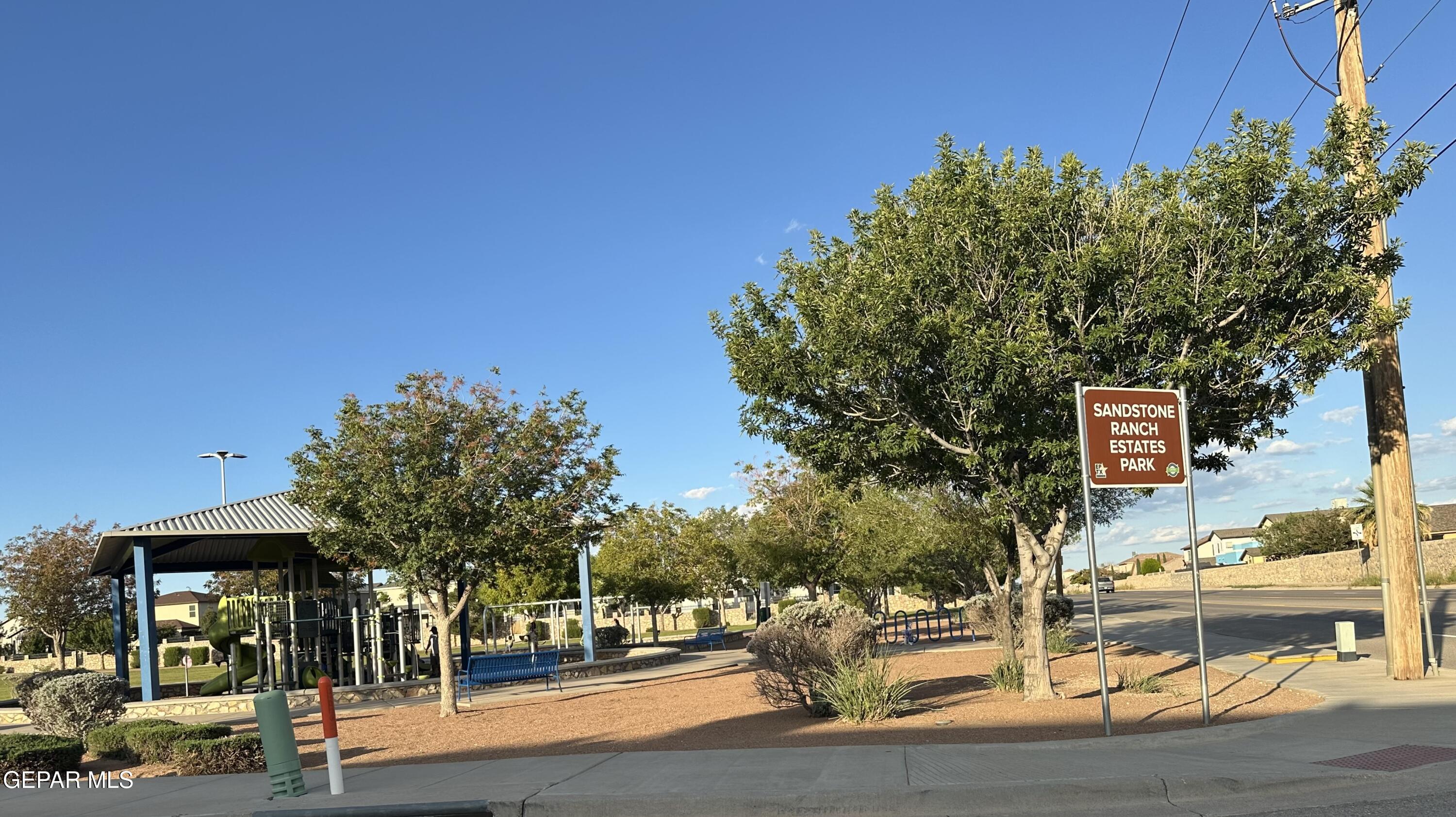 11528 Rafael Serna Lane El Paso, TX 79934 - Photo 21 of 22 a sign board with buildings in the background