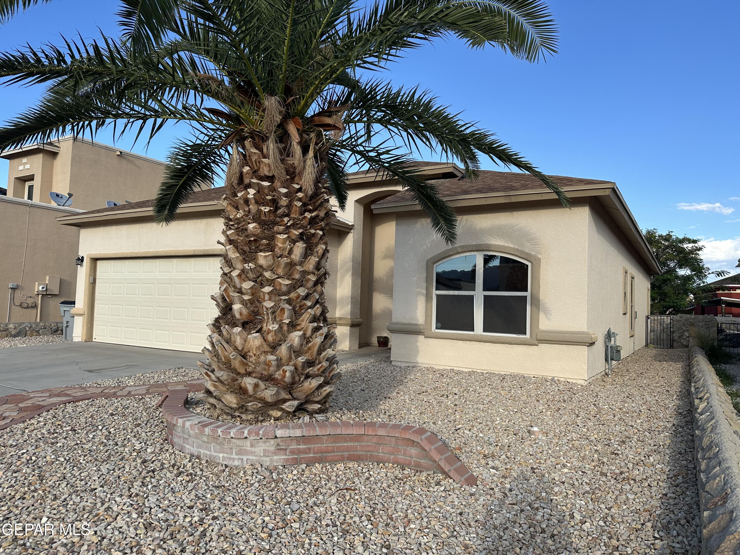 11528 Rafael Serna Lane El Paso, TX 79934 - Photo 4 of 22 a front view of a house with a yard