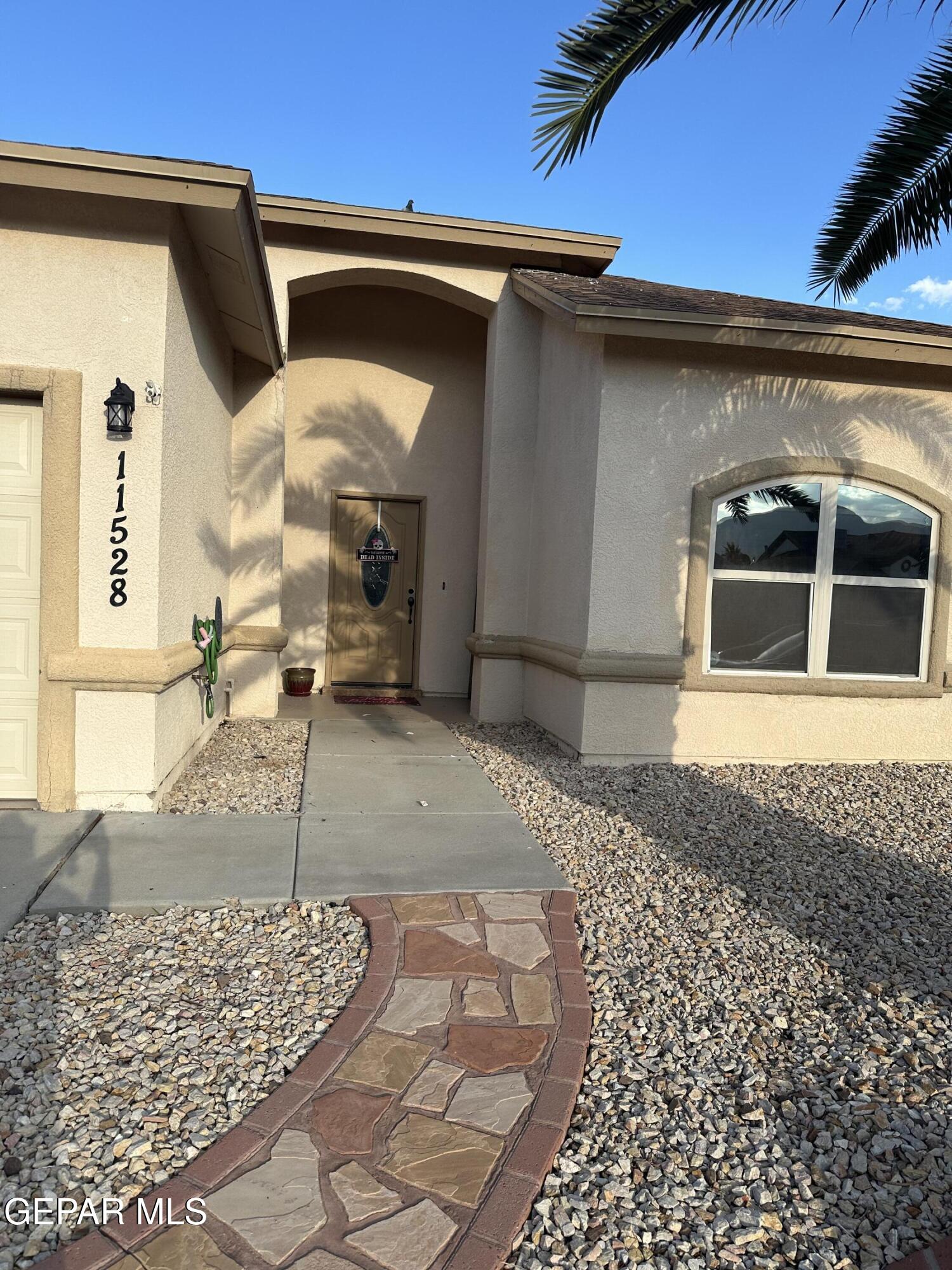 11528 Rafael Serna Lane El Paso, TX 79934 - Photo 7 of 22 a front view of a house with a