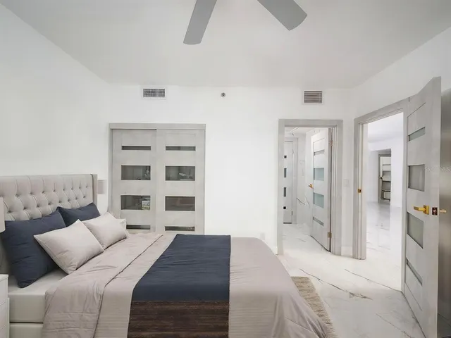 a bathroom with a sink toilet tub and shower