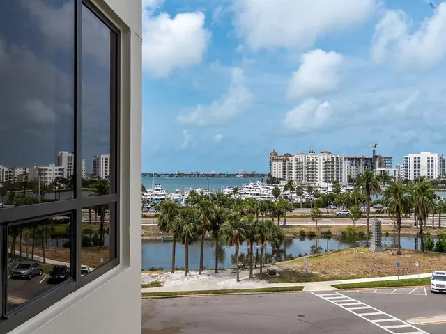 a living room with lots of furniture and a book shelf
