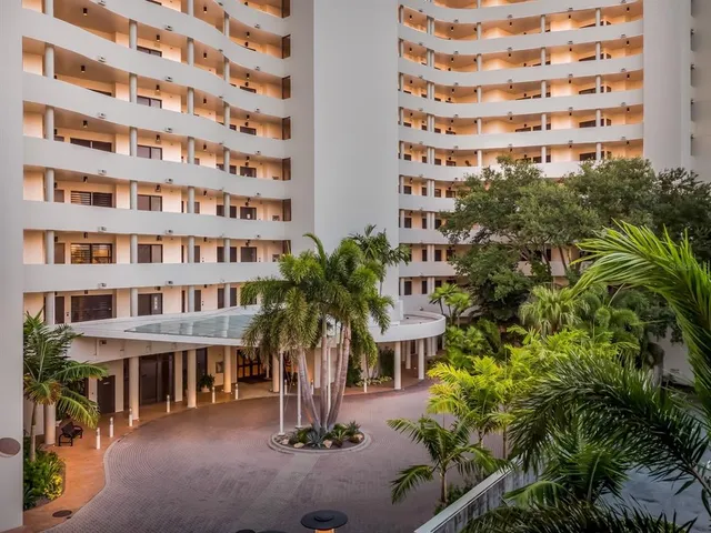 a view of building with river in front of it