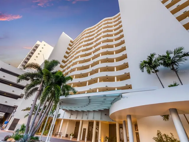 a view of a livingroom with a sink and cabinets