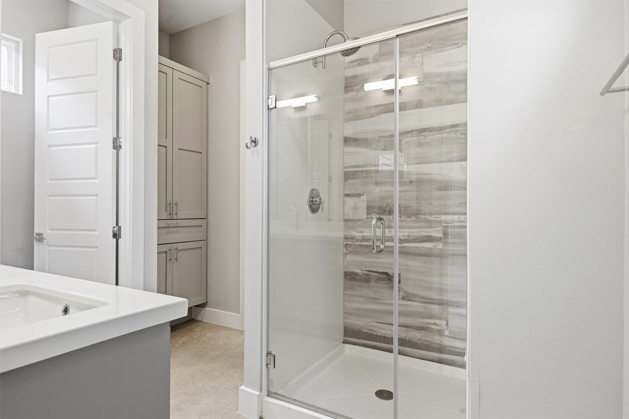 1210 Stobaugh Street, Unit B Austin, TX 78757 - Photo 20 of 40 A well-appointed bathroom with a spacious glass-enclosed shower.
