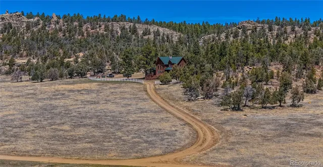 a view of front door of house with wooden floor