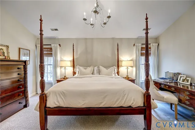a bathroom with a granite countertop sink mirror and a bathtub